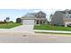 Two-story home with a front porch and attached two-car garage at 316 Foxglove Way, Mcdonough, GA 30253