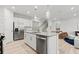 Elegant kitchen featuring stainless steel appliances, granite countertops, and a seamless flow into the cozy living space at 316 Foxglove Way, Mcdonough, GA 30253