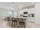 Well-appointed kitchen with an island, granite countertops, stainless appliances, and an adjacent dining area with natural light at 316 Foxglove Way, Mcdonough, GA 30253