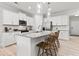 Bright kitchen featuring granite countertops, stainless steel appliances, and ample cabinet space for storage at 316 Foxglove Way, Mcdonough, GA 30253