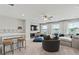 Large living room with plush seating, a ceiling fan, and plenty of natural light at 316 Foxglove Way, Mcdonough, GA 30253