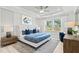 This spacious main bedroom offers a ceiling fan, large window and stylish decor at 316 Foxglove Way, Mcdonough, GA 30253