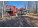 House backside showcasing a deck, screened porch and large backyard at 3880 Northpoint Dr, Marietta, GA 30062