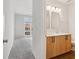 Bathroom with light wood cabinets and double vanity at 457 Parkway Ne Dr, Atlanta, GA 30308