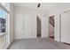 Bedroom with double doors to closet and grey carpeting at 457 Parkway Ne Dr, Atlanta, GA 30308