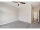 Spacious bedroom with ceiling fan and grey carpeting at 457 Parkway Ne Dr, Atlanta, GA 30308