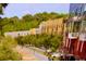 Aerial view of a vibrant community with tree-lined pathways and modern buildings at 457 Parkway Ne Dr, Atlanta, GA 30308