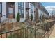 Modern townhomes with orange entry doors, landscaping, and black metal fence at 457 Parkway Ne Dr, Atlanta, GA 30308