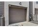 Private garage with gray door and white brick exterior at 457 Parkway Ne Dr, Atlanta, GA 30308