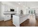 Modern kitchen with white cabinets, large island, and stainless steel appliances at 457 Parkway Ne Dr, Atlanta, GA 30308