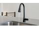 Modern kitchen sink with black faucet at 457 Parkway Ne Dr, Atlanta, GA 30308