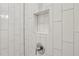 Close-up of shower niche detail with white subway tile at 457 Parkway Ne Dr, Atlanta, GA 30308