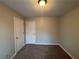 Well-lit bedroom featuring neutral walls and carpet flooring at 460 Deering Dr, Douglasville, GA 30134