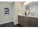 Bathroom with double vanity, dark brown cabinets, and black tile flooring at 344 Foxglove Way, Mcdonough, GA 30253
