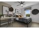 Stylish bedroom with a metal framed bed, a workspace, and wall art at 344 Foxglove Way, Mcdonough, GA 30253