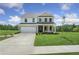 Two-story house with brick and siding, a white garage door, and a landscaped lawn at 344 Foxglove Way, Mcdonough, GA 30253
