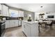 Modern kitchen with white cabinets, island, and stainless steel appliances at 344 Foxglove Way, Mcdonough, GA 30253