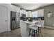 Modern kitchen with white cabinets, stainless steel appliances, and an island at 344 Foxglove Way, Mcdonough, GA 30253