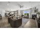 Open living room and kitchen with hardwood floors, a fireplace, and comfortable seating at 344 Foxglove Way, Mcdonough, GA 30253