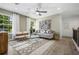 Spacious living room with neutral decor, comfy seating, and hardwood floors at 344 Foxglove Way, Mcdonough, GA 30253