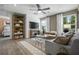 Bright living room features neutral decor, a comfy sofa, and hardwood floors at 344 Foxglove Way, Mcdonough, GA 30253