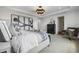 Main bedroom with a large bed, stylish decor, and neutral color palette at 344 Foxglove Way, Mcdonough, GA 30253