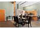 Dining room with a modern glass table and leather chairs, adjacent to an open kitchen at 350 Peters Sw St # 3, Atlanta, GA 30313