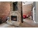 Stone fireplace detail against exposed brick, showcasing a unique design and an open bedroom concept at 350 Peters Sw St # 3, Atlanta, GA 30313