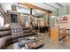 Expansive living room with a stone fireplace, exposed beams and ductwork, and an open floor plan at 350 Peters Sw St # 3, Atlanta, GA 30313