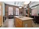 Open-concept living space featuring exposed brick, modern lighting, fireplace, and a breakfast bar at 350 Peters Sw St # 3, Atlanta, GA 30313
