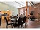 Open living space combining dining, kitchen, and living areas with exposed brick and timber beams at 350 Peters Sw St # 3, Atlanta, GA 30313