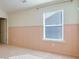 Charming bedroom with light pink wainscoting and carpet at 6760 Grove Meadows Ln, Cumming, GA 30028