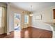 Breakfast area with hardwood floors and access to backyard at 6760 Grove Meadows Ln, Cumming, GA 30028