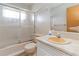 Bathroom with tub shower, vanity and updated flooring at 2210 Lisa Se Dr, Marietta, GA 30067