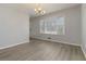 Dining area with wood-look flooring and large window at 2210 Lisa Se Dr, Marietta, GA 30067