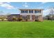 Two-story brick house with a spacious lawn and mature trees at 2210 Lisa Se Dr, Marietta, GA 30067