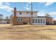 Rear view of house showcasing yard and sunroom at 2210 Lisa Se Dr, Marietta, GA 30067