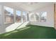 Sunroom with multiple windows and artificial turf at 2210 Lisa Se Dr, Marietta, GA 30067