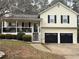 Two-story house with a two-car garage and front porch at 41 Lady Savannah Dr, Dallas, GA 30157