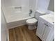 Bathroom featuring a tub with shower, toilet and vanity with sink at 296 Grist Mill Ln, Lawrenceville, GA 30046