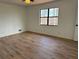 Bright bedroom featuring a large window and wood flooring at 296 Grist Mill Ln, Lawrenceville, GA 30046