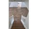 Looking down the wooden staircase with white railings at 296 Grist Mill Ln, Lawrenceville, GA 30046