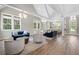 Spacious clubhouse lounge area with stylish seating, large windows, and modern lighting fixtures at 440 Dahlia St, Mcdonough, GA 30253