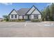 Charming home with stone accents, well-maintained landscaping, and ample parking space at 440 Dahlia St, Mcdonough, GA 30253