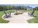 Community fire pit with seating, providing a cozy outdoor space for residents at 440 Dahlia St, Mcdonough, GA 30253