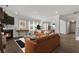 Bright living room with fireplace, hardwood floors, and large windows offering lots of natural light at 440 Dahlia St, Mcdonough, GA 30253
