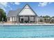 Relaxing community pool featuring lounge chairs and a covered pavilion, perfect for outdoor enjoyment at 440 Dahlia St, Mcdonough, GA 30253