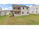 Expansive backyard featuring a covered deck, a patio, and lush greenery, perfect for outdoor living and entertaining at 715 Crossroad Ct, Powder Springs, GA 30127
