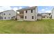 Spacious backyard with a well-maintained lawn and patio area, perfect for outdoor activities and entertaining at 715 Crossroad Ct, Powder Springs, GA 30127