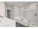 Modern bathroom featuring double sinks, a soaking tub, and a separate glass-enclosed shower with black fixtures at 715 Crossroad Ct, Powder Springs, GA 30127